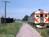 CP RDC-4 9200 and an RDC-3 head up the TH&B Budd run from Buffalo to Toronto, seen taking on passengers at Fort Erie station after crossing the border from the US into Canada. In the background, some industrial markers of nearby Buffalo can be seen across the Niagara River. CP only had three RDC-4 (baggage/RPO) cars, and photos suggest 9200 saw the most use on this train (9250/51 spent most of their time on the <a href=http://www.railpictures.ca/?attachment_id=14626><b>Sudbury-White River</b></a> runs).<br><br>According to timetables from that era, this would be Penn Central train #371, scheduled to be at Fort Erie a little after 5pm, and due into Toronto just before 8pm. This train actually had three(!) different train numbers on the schedule: it was PC #371 from PC's Buffalo Terminal to Welland, TH&B #371 from Welland to Hamilton, and CP #322 from Hamilton to Toronto. The eastbound train had a similar numbering scheme (CP 321/TH&B 376/PC 376). The TH&B Budds would continue into the VIA era until being <a href=http://www.railpictures.ca/?attachment_id=9031><b>discontinued in 1981</b></a>, just prior to Amtrak's Maple Leaf service <a href=http://www.railpictures.ca/?attachment_id=41208><b>starting up</b></a>.<br><br><i>Harold E. Brouse photo, Dan Dell'Unto collection slide.</i>