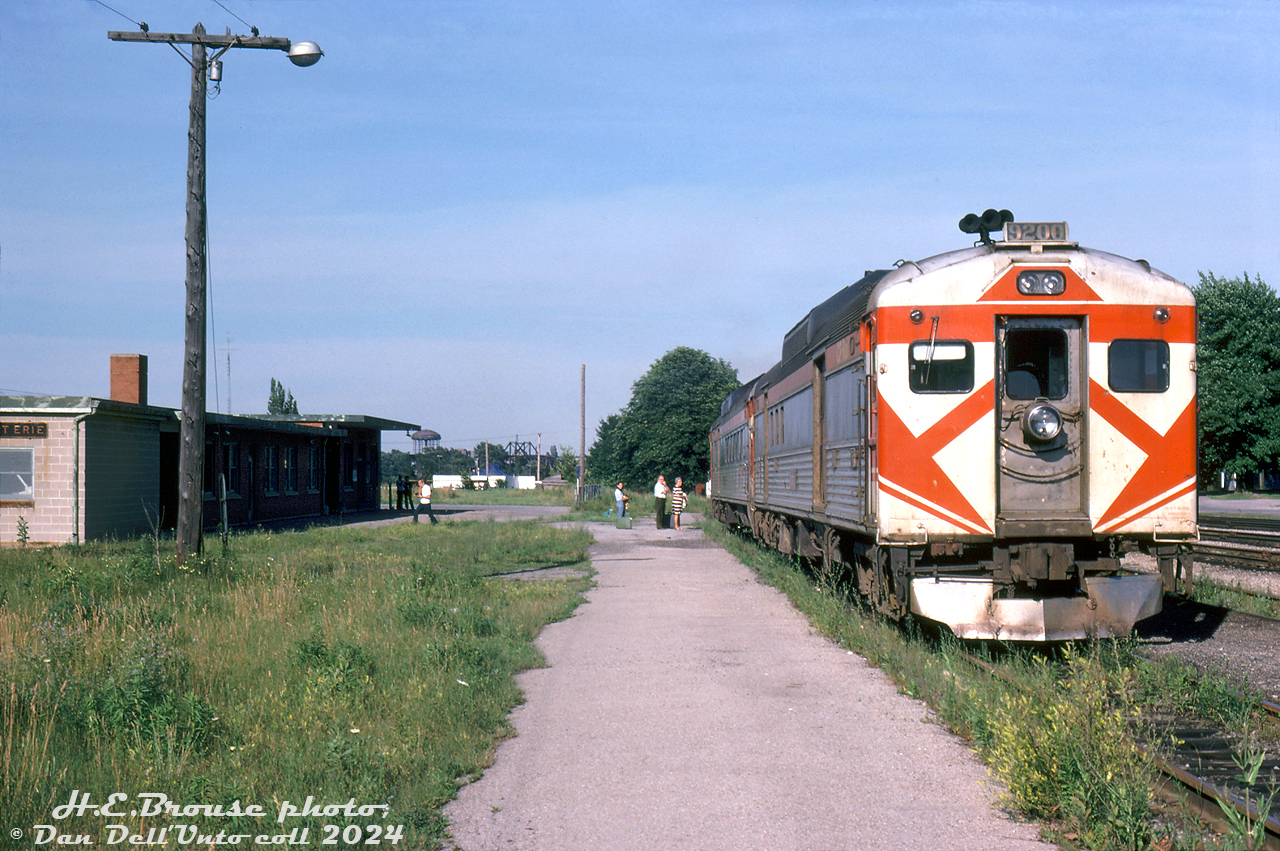 CP RDC-4 9200 and an RDC-3 head up the TH&B Budd run from Buffalo to Toronto, seen taking on passengers at Fort Erie station after crossing the border from the US into Canada. CP only had three RDC-4 (baggage/RPO) cars, and photos suggest 9200 saw the most on this train (9250/51 spent most of their time on the Sudbury-White River runs).

According to timetables from that era, this would be Penn Central train #371, scheduled to be at Fort Erie a little after 5pm, and due into Toronto just before 8pm. This train actually had three(!) different train numbers on the schedule: it was PC #371 from PC's Buffalo Terminal to Welland, TH&B #371 from Welland to Hamilton, and CP #322 from Hamilton to Toronto. The eastbound train had a similar numbering scheme (CP 321/TH&B 376/PC 74). The TH&B Budds would continue into the VIA era until being discontinued in 1981, just prior to Amtrak's Maple Leaf service starting up.

Harold E. Brouse photo, Dan Dell'Unto collection slide.