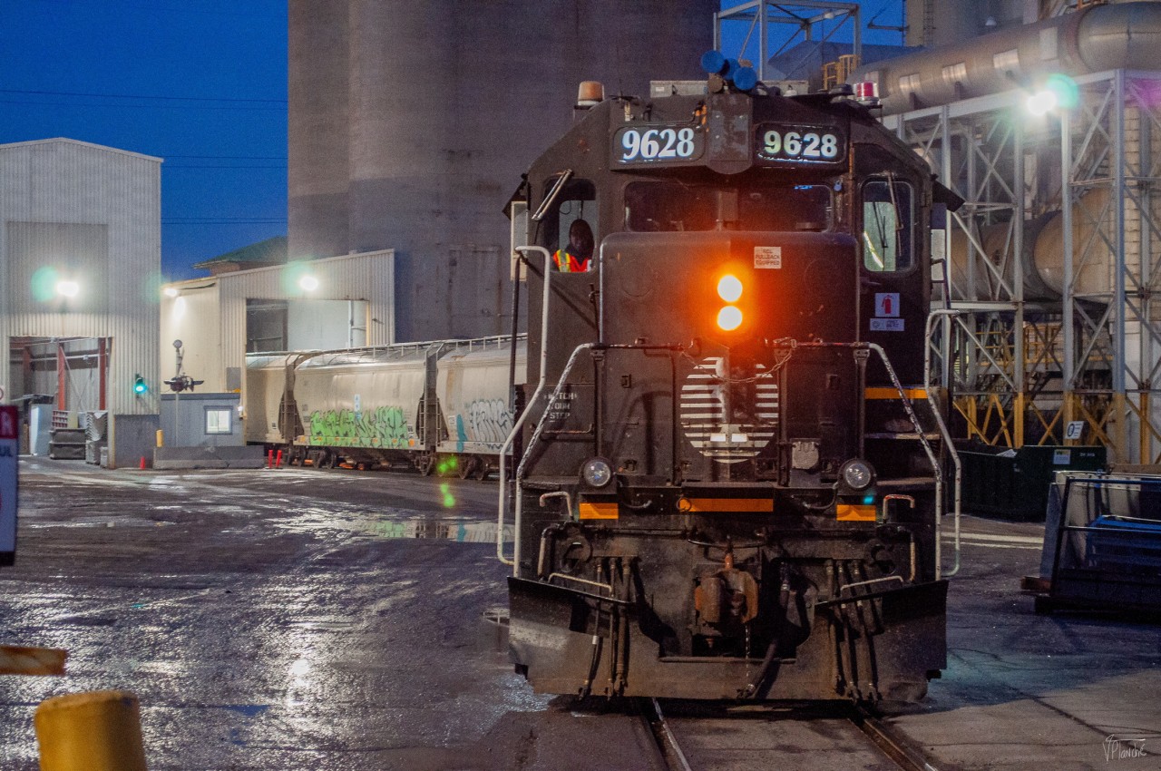 On February 23, 2024, CN 596 serves the customer OI Canada (Owens Illinois Corp), west of VIA Rail's MMC.