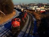 On the first full day of sun that Montreal has seen in quite some time, CN 527 heads west with CN 8954 leading four more units and a short train.