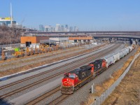 On February 13, 2024, CN 527 passes gently under the Turcot interchange, en route to Taschereau