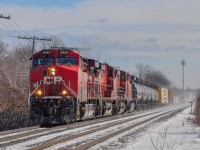 On February 17, CPKC 231 has just crossed the hollow between Beaconsfield and Beaurepaire and is preparing to cross the level crossing east of the EXO station.