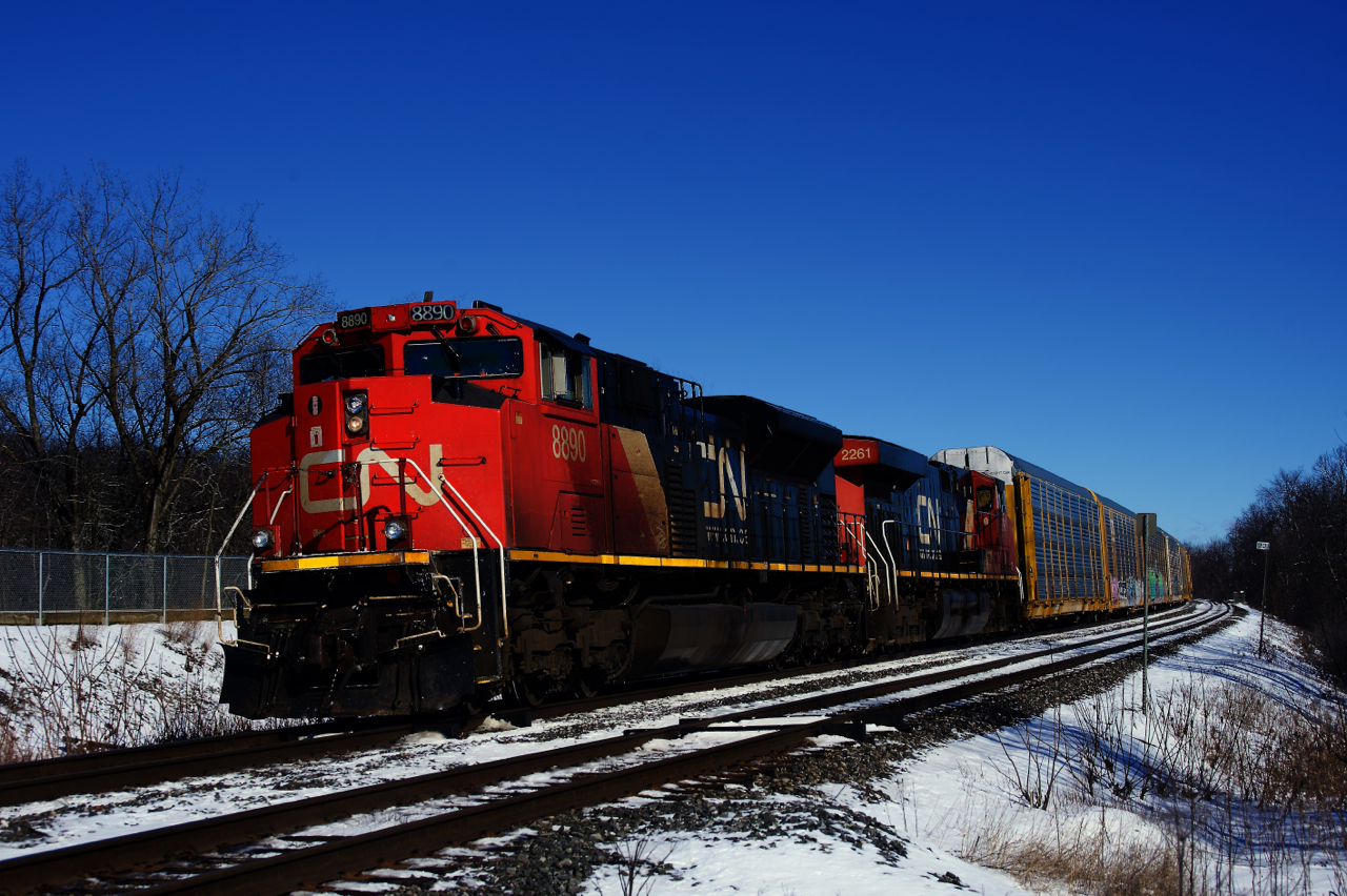 Running slightly later than usual, autorack train CN 271 passes MP 22 of CN's Kingston Sub.