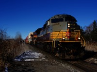 CP 2-112 is approaching Pine Beach Station with heritage unit CP 7013 and KCS 4612 up front on a cold and clear morning.