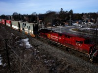A CPKC 112 with 442 axles passes through Pointe-Claire with CP 8107 up front.