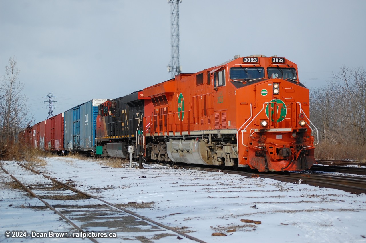 On a cold winter morning CN 421 with CN (EJE) ET44AC 3023, CN ES44AC 2970, and DPU: CN ES44AC 2867 at Merritton on Feb 29/24.