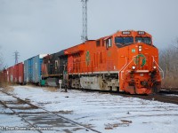 On a cold winter morning CN 421 with CN (EJE) ET44AC 3023, CN ES44AC 2970, and DPU: CN ES44AC 2867 at Merritton on Feb 29/24.