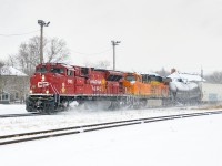 What a difference 48 hours makes. With a new trailing unit, BNSF 8136, 238 stirs up today's recent dusting.
