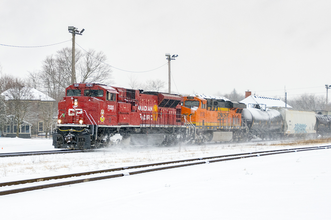 What a difference 48 hours makes. With a new trailing unit, BNSF 8136, 238 stirs up today's recent dusting.