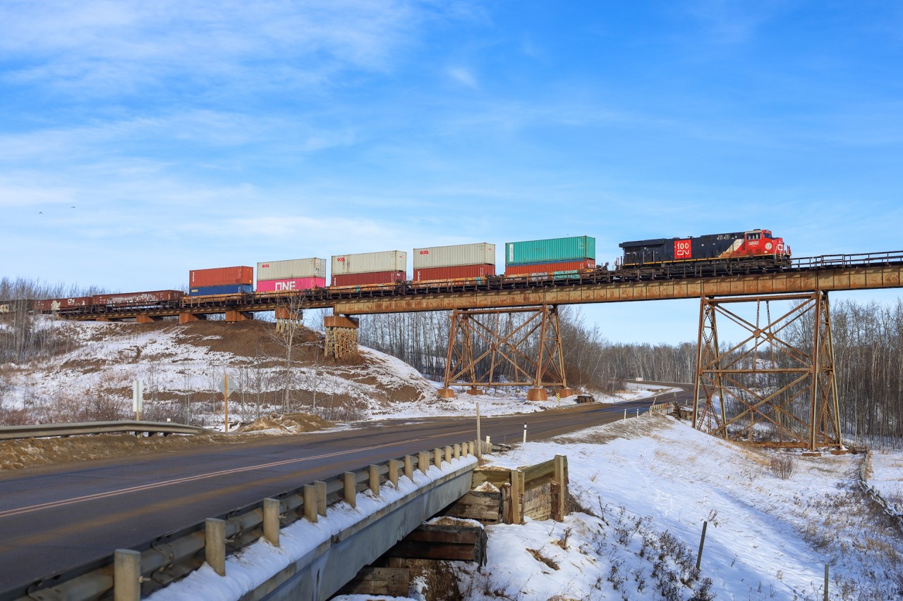 Vancouver to Chicago M 35651 25 rolls across the Magnolia Trestle, which crosses a range road, the Sturgeon River and the Yellowhead Highway.