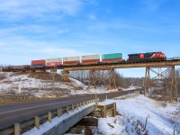 Vancouver to Chicago M 35651 25 rolls across the Magnolia Trestle, which crosses a range road, the Sturgeon River and the Yellowhead Highway. 