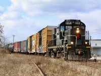 One of those days today where all plans went out the window. Hearing that today would be GIO Rails last trip down the canal sub. to serve the last few customers in St. Catharines was enough to get me up early after night shift. The plan was to catch them around Allanburg then passing lock 7 both ways. Unfortunately they arrived in St. Catharines almost an hour before I arrived. I was forced to change plans and head to the spur along Yale Crescent and try to at least catch them working the old paper plant. Unfortunately the crew had to wait several hours as four boxcars were unloaded only to have RS18 1859 suffer a major oil leak prior to departing the area. In the end the train was forced to call it a day parking everything on the spur and draining the unit. Not sure what the plan is now as far as heading home eventually. Nevertheless there was a good railfan turn out for the activity despite the bitterly cold weather. Here 1859 is seen with the compartment doors open preparing to shut everything down after retrieving the last two boxcars from the paper plant. 