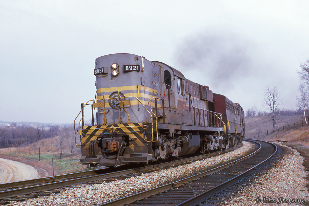 Continuing the chase from Hornby, extra 8921 west works upgrade along the Niagara escarpment a little west of Milton at Christie.Scan and editing by Jacob Patterson.