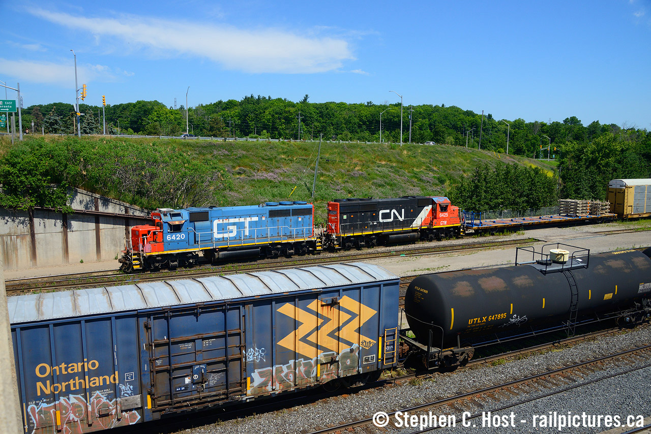 The last two DT&I GP40's left on the roster, former DT&I 420 and 425 work Aldershot yard paired for a few days in the summer of 2022. You can really see the blue coming through on the roof of 6425 from this overhead view.