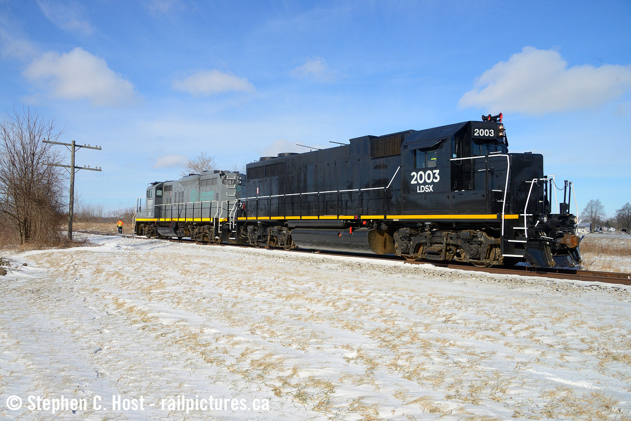 Ahh, remember winter? (Eastern Canadians: put down your pitchforks, I know you still have winter, LOL). Winter's basically done in Southern Ontario (or is it?) and I'm posting this during what seems to be spring weather, despite a full month of  winter still before us. Now, there's a theme to this caption.... you'll see why in a second.

There were countless photos, declarations, and even articles in magazines declaring This train as the last on the Cayuga subdivision, surely if the fabled OSR can't make a go of it, nobody can, right? Right :)

Pictured after a chance encounter and chase on a 'rare' Monday GIO run, after pulling around 25 cars to New Sarum from St. Thomas they just finished setting of a half dozen in the siding and will take 20 more cars toward Aylmer and Tillsonburg filling up sidings all along the way. GIO's really doing their best to deny the naysayers - not only is there new business at Future Transfer (Salt/Potash) the size of their trains have also become impressive after my first encounter in 2022 with a two car train. GIO continues to impress, but changes are coming. According to CN's three year plan the Cayuga east of Courtland is to be abandoned, which is probably only a mile or two of railway anyway. To me this is a surprise as there's plenty of open land with highway on one side, railway on the other, ripe for an industrial customer, but on the other hand, it makes sense - they can eliminate the grade crossing and maintenance in Courtland and save money, improving profitability. Also it's highly like that Norfolk County isn't on board with the Railway and CN/GIO can just locate customers in more friendly Tillsonburg or elsewhere instead. Either way, CN and GIO would be both in agreement, we'll just have to wait and see if it gets ripped up :)