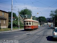 TTC Peter Witt streetcar 2766 is seen returning back to the yard from an overnight fantrip around the city, and is shown about to enter the back of St. Clair (Wychwood) Carhouse yard on the tracks off Wychwood Avenue at Benson Avenue. St. Clair Avenue can be seen in the distance. Photographer John Bromley's white mid-60's Plymouth Barracuda is visible parked on the right (sold as a Valiant Barracuda early on in Canada, hence the trunk lettering).
<br><br>
By 1965, the few remaining cars of TTC's fleet of old Peter Witt streetcars were facing their last months of revenue service (most were retired in 1963 when the University subway line opened, the remaining cars saw infrequent use), and enthusiasts often <a href=http://www.railpictures.ca/?attachment_id=47439><b>chartered cars for fantrips</b></a> while they were still active. Photos show during this June 27th 1965 overnight and morning fantrip, 2766 made visits to Mimico, Dufferin Loop, Runnymede Loop, Viaduct Loop, Harbourfront Loop, Bedford Loop, and St. Clarens Loop. 2766 was the last active car, retired in July 1965, but kept by the TTC and later refurbished for <a href=http://www.railpictures.ca/?attachment_id=32946><b>Tour Tram service</b></a> in the early 1970's.
<br><br>
<i>John F. Bromley photo, Dan Dell'Unto collection slide.</i>