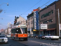 TTC CLRV 4159 is short-turning on a 505 Dundas run, heading southbound on Church Street approaching Queen Street. It's passing "pawn shop alley" along Church, this area long known for its many pawn shops. McTamney's Pawnbrokers and Williams Pawnbrokers are visible here, and Grant's Pawnbrokers and Thifty's occupied multiple storefronts to the south along with various other used buy and sell stores in the immediate area (some still survive here today, including McTamney's).
<br><br>
<i>Robert D. McMann photo, Dan Dell'Unto collection slide.</i>