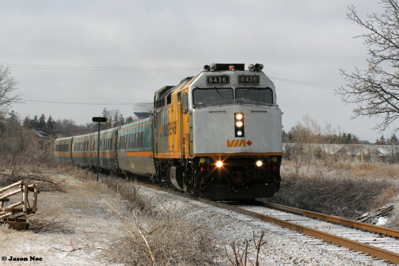 During an icy morning VIA Rail train 84 with F40PH-3 6436 heads east through Baden, Ontario on the CN Guelph Subdivision.