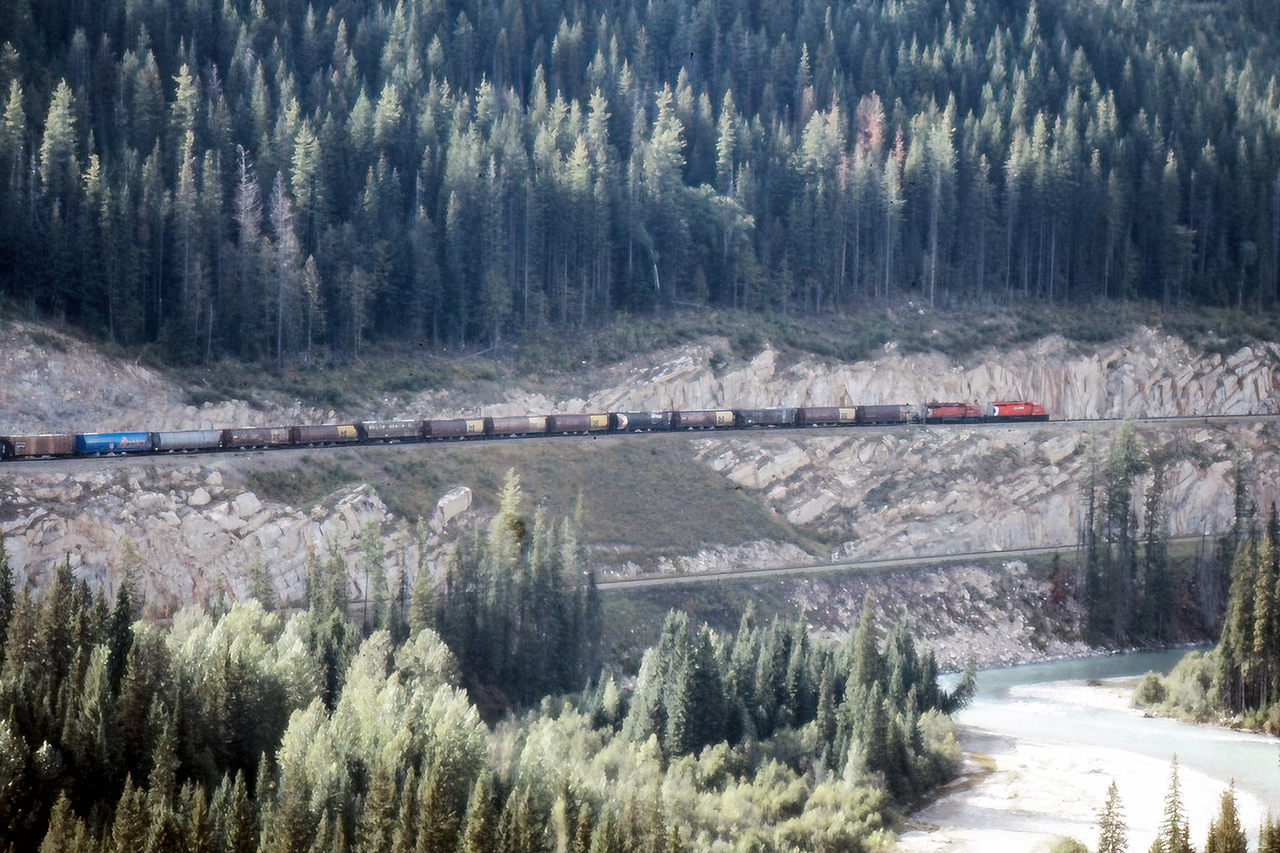 Grain empties descending on the original line. I wonder if this view is even possible 30 years later. Scanned from a print.