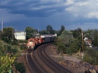 A late afternoon westbound runs through the curves north of Ramsey Lake, approaching Sudbury Station.