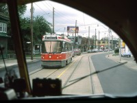 It is an overcast day in Toronto in August 1986. I am in a TTC PCC streetcar which is about to have a meet with TTC 4180.