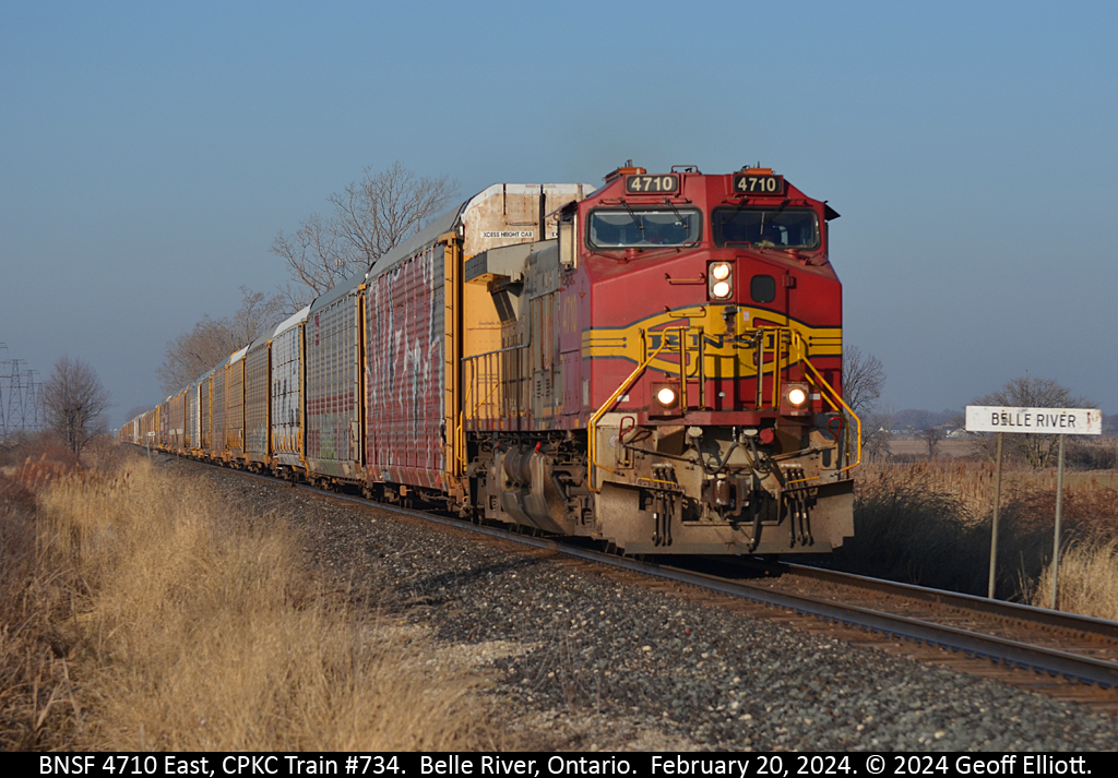 I'm not a smoker, but I don't mind getting out to shoot a 'cigar band' from time to time.  BNSF Warbonnet #4710 leads empty CPKC autorack train #734 east past the Belle River mile board as it approaches Strong Road near MP #92 of the CPKC Windsor Subdivision on February 20, 2024.