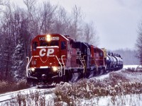 A long time favourite spot for me on the north end of the Hamilton subdivision was this crossing north of Carlisle. Some 26 years ago I took my first shot here, back then if you heard a 5400 leading a train, you didn’t miss it. Definitely some of the more colourful units as far as history goes. Here CP 5423, an ex UP/MP SD40-2 leads a borrowed NS SD40 and another CP SD40 as they head southbound through the snow. 