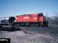 CP C-424 4240 is pictured crossing the CN Dundas Subdivision in Woodstock, Ontario as it returns to the yard from a run on the CP St. Thomas Subdivision. This location is now known as Carew. 