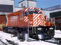 The very first new EMD/GMD SD40-2 unit for CP Rail, 5565, sits in sparkling action red paint outside the Alyth Yard diesel shop in Calgary, Alberta. Delivered to CP on February 16th 1972, 5565 was less than a month old when this photo was taken, and possibly on its first maiden voyage out west. GP9 8611 in older maroon & grey script paint sits in the background.<br><br>CP 5565 was part of the first order of CP SD40-2's, 5565-5588, built at GMD's London, Ontario assembly plant and delivered in February-March 1972. They were numbered above CP's SD40 series (5500-5564), and the new "Dash 2" model featured a number of improvements on the earlier SD40 design (that CP had had teething problems with). Impressed with their reliability, they became CP's main 3000-horsepower 6-axle road power across much of the system for decades, with CP eventually accumulating over 500 new and secondhand units (CP was the third-largest SD40-2 owner, behind BN and UP).<br><br>CP 5565 was retired and sold to Progress Rail in 2007, eventually falling off the radar (possibly scrapped or stored out of service somewhere).<br><br><i>Doug Wingfield photo, Dan Dell'Unto collection slide.</i>
