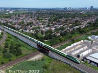 An afternoon lull after some morning VIA and CN traffic at Snider yields some action on the Barrie GO line. Here, GO Transit MP40PH-3C 628 brings up the rear of afternoon train #6915, heading north on the Newmarket Sub over the York Sub flyover at Snider. It's been a number of years since the nearby neighbourhoods in suburban Thornhill and Concord have had to hear the regular clatter of trains across the interlocking diamonds that were once at this location for decades. In a few minutes, southbound GO train #6916 coming down from Rutherford GO station will put in an appearance.
<br><br>
<i>Note: photo taken while above adjacent property and zoomed in, complying with all Transport Canada drone regulations for appropriate RPAS micro drone weight class.</i>