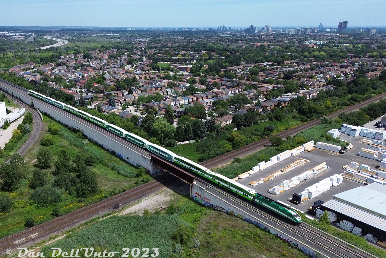An afternoon lull after some morning VIA and CN traffic at Snider yields some action on the Barrie GO line. Here, GO Transit MP40PH-3C 628 brings up the rear of afternoon train #6915, heading north on the Newmarket Sub over the York Sub flyover at Snider. It's been a number of years since the nearby neighbourhoods in suburban Thornhill and Concord have had to hear the regular clatter of trains across the interlocking diamonds that were once at this location for decades. In a few minutes, southbound GO train #6916 coming down from Rutherford GO station will put in an appearance.

Note: photo taken while above adjacent property and zoomed in, complying with all Transport Canada drone regulations for appropriate RPAS micro drone weight class.