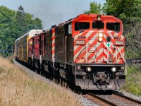 I'm going to guess this is CP 147...or whatever it was called in those days. All racks, 2 barns, 2 more SD40-2's. IMHO, this was railroading at its bets before AC traction, and DPU's (with their admitted train handling benefits) taking over completely. 