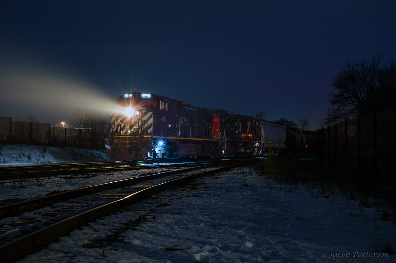 CN L533 ties back onto its train after lifting a cut of cars out of XW20 at CN Guelph Junction Wellington.