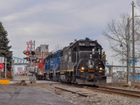 On March 5, 2024, the CN 500 leaves the port of Montreal with a 1,500-foot train: gondolas, grain and empty container ships.