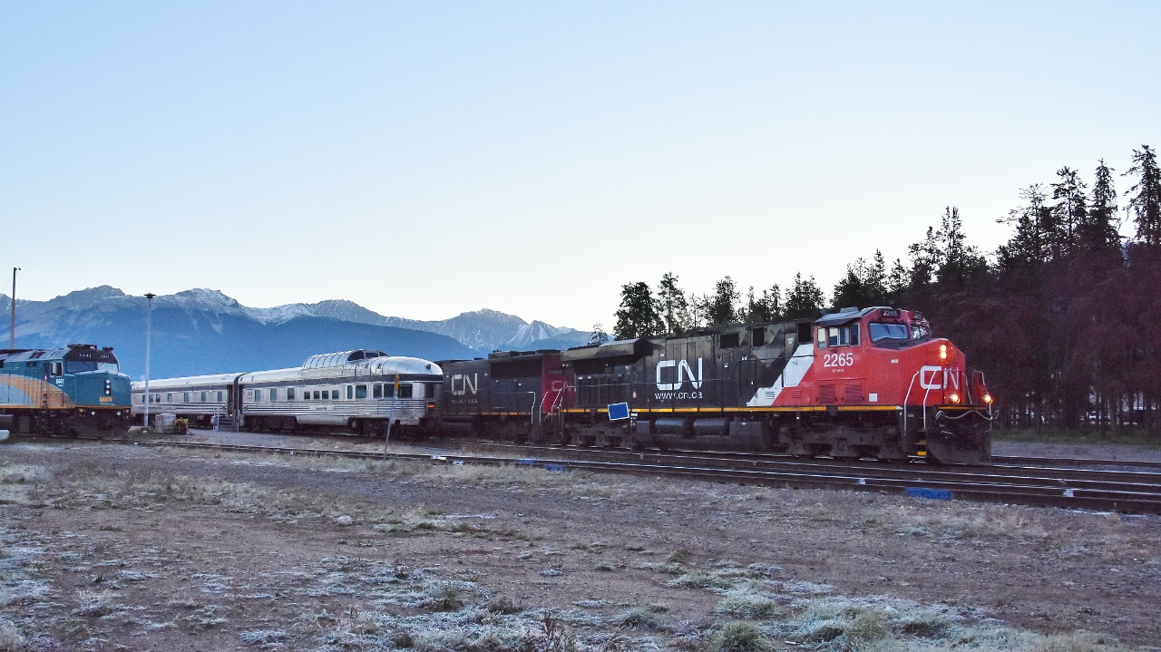 On a frosty September morning, the VIA #2, Canadian is at the station,


 with visible tail end  cars: 88207 Prestige Chateau Dollard and 88709 Prestige Laurentide Park.


departing westward is CN 2265  – 5489; 


a GE 2007 built ES44DC (GEVO-12 cylinder) and EMD built SD60 (16-710G3 engine) - the last SD60 of 90 in the series delivered 1986....


GMD 1989 built, and re-built by CAD 2010, F40PH-3 VIA 6441  idles on the Jasper back track.


... a half hour after sunrise, at Jasper, September 19, 2018 digital by S.Danko


      westbound 'varnish'   


sdfourty