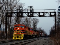After awaiting its signal here for about 45 minutes, QG 501 is on its way to enter CPKC's St-Luc Yard with three ex-BNSF SD70MACs for power. In a very short distance it will meet grain train CPKC 322, on its way to the Port of Montreal.