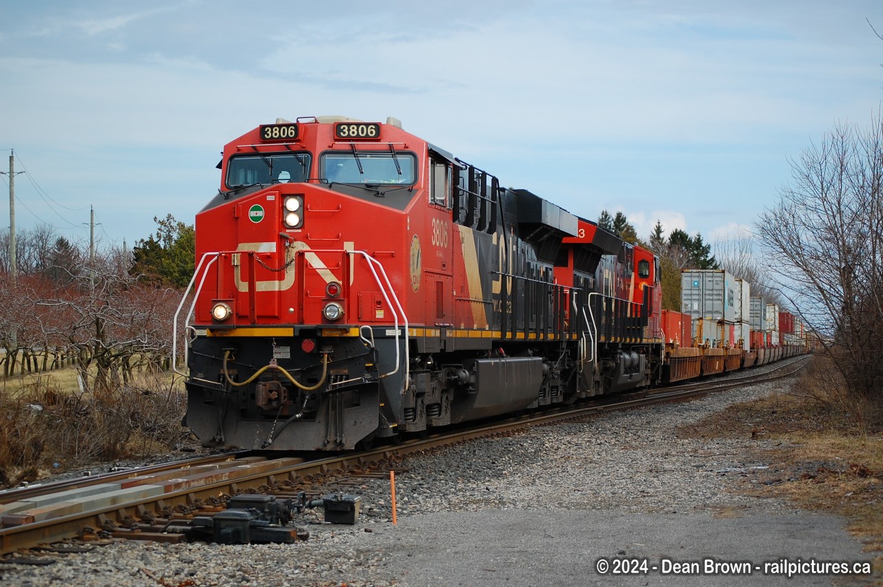 On a warm afternoon, X422 with CN ES44AC 3806 and CN ET44AC 3163 and 97 cars were lifted at Fort Erie on March 5/24.