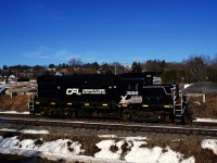RS-18 CFL 3000 is heading back to the head end of its train after lifting two hoppers at a mill in its hometown of Saint-Félix-de-Valois.