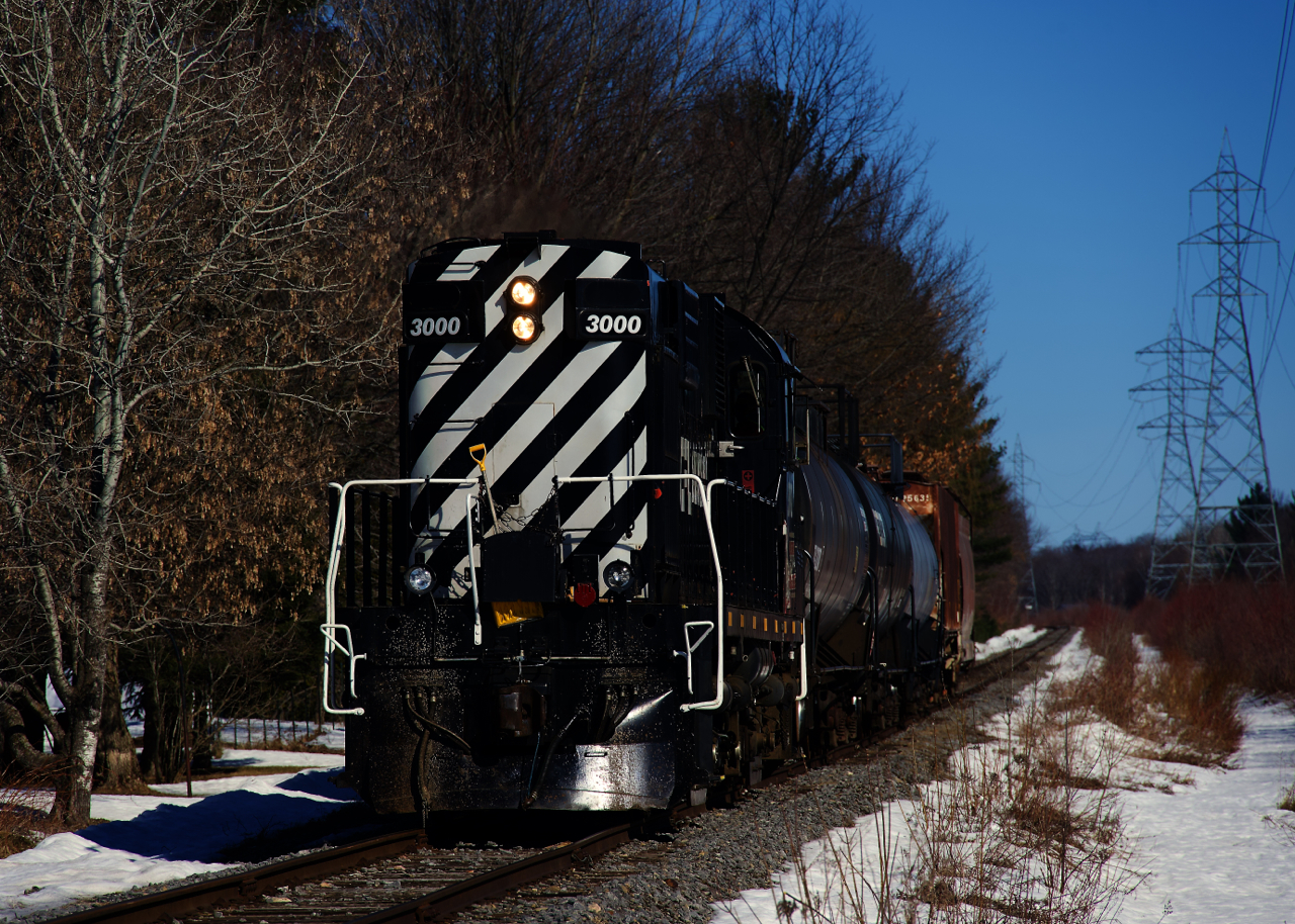 The chemin de fer Lanaudière is heading to Joliette (to interchange with the Québec-Gatineau Railway) with 3 tank cars and 2 hoppers on a sunny morning.