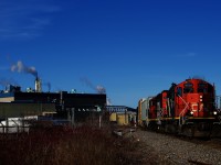 CN 587 with a pair of GP9s is arriving at Crabtree, where it will switch the Kruger plant.