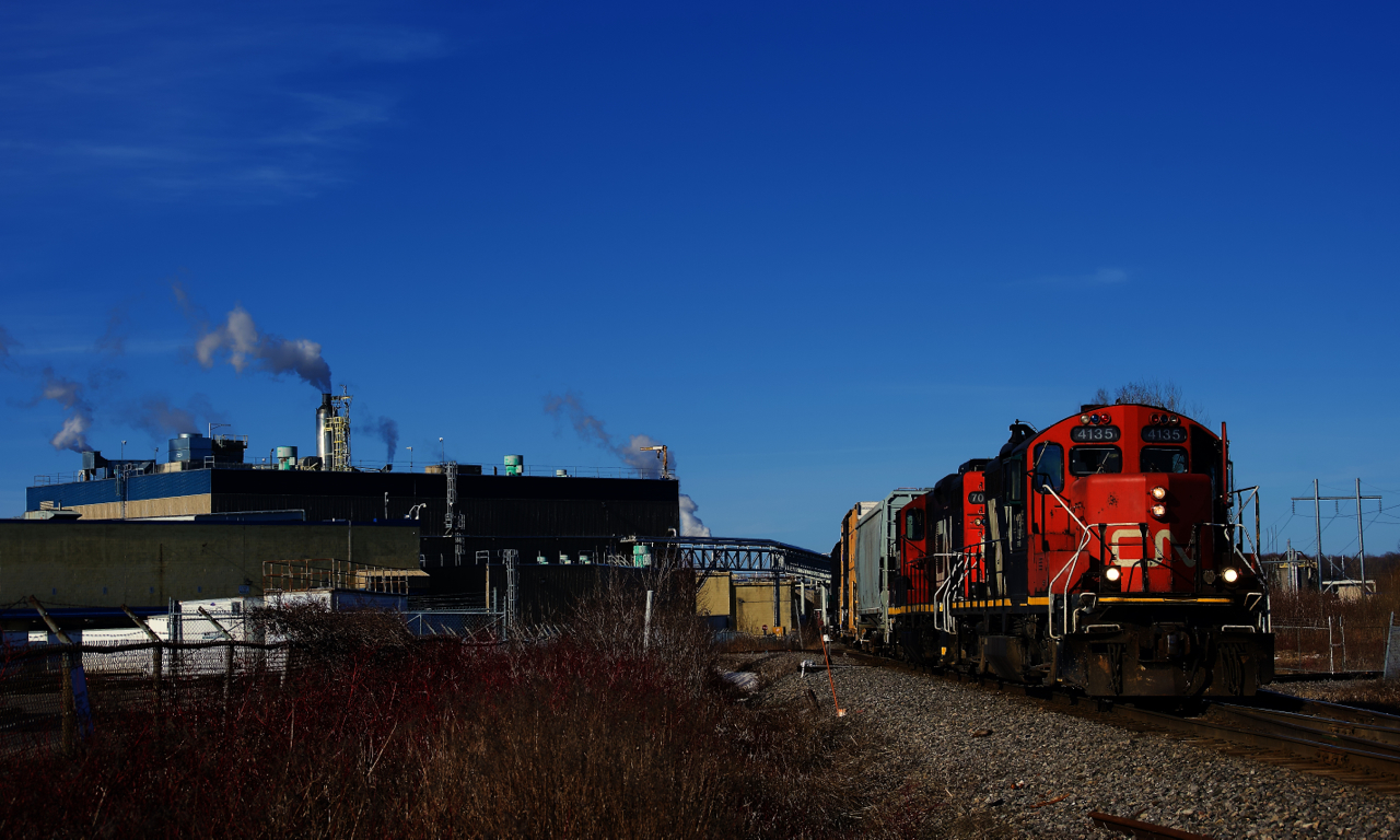 CN 587 with a pair of GP9s is arriving at Crabtree, where it will switch the Kruger plant.