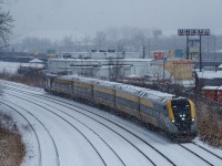 VIA 633 for Ottawa passes through Montreal West during a brief but intense period of snow.