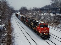 A short CN 324 rounds a curve during some heavy but short-lived snow.