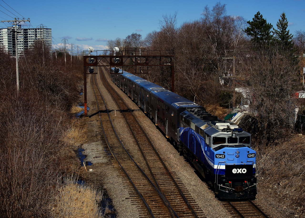 An EXO test run is nearly done its Lucien L'Allier to Saint-Jérôme and back run as it approaches North Jct with F59PH EXO 1342 and six CRRC cars. It was stopping at every station and opening doors as part of a simulated run.