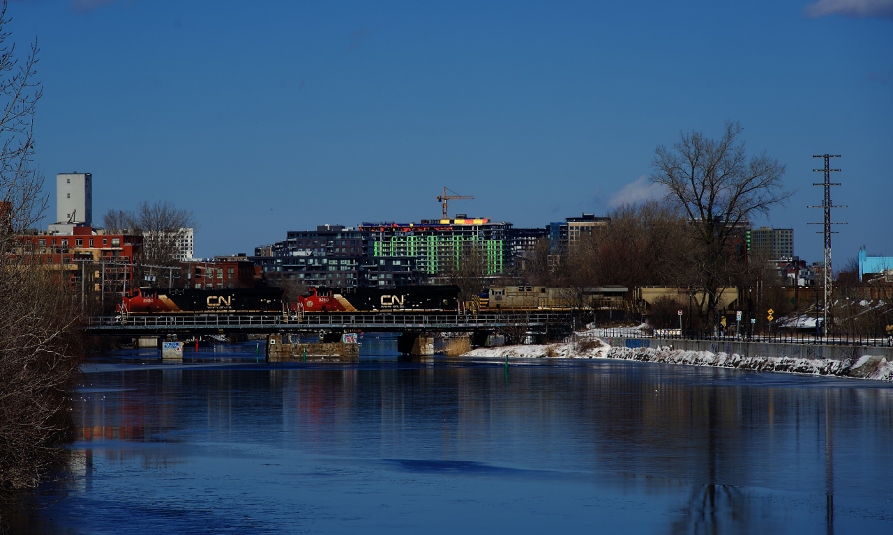 Empty potash train CN B731 has three GEs up front as it crosses the Lachine Canal.