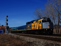 Wrapped VIA 6420 leads a Renaissance consist as VIA 24 passes the west end of the Butler Spur.