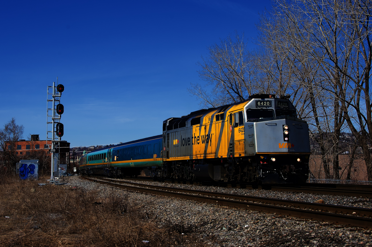 Wrapped VIA 6420 leads a Renaissance consist as VIA 24 passes the west end of the Butler Spur.