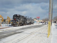 TRRY RS-18u #1859 pulls 2 tank cars from Kemira alongside Berryman Ave, this was a part of the last run of GIO Rail (Trillium Railway) to St. Catharines. The trip was quickly cut short due to an oil leak though, which caused the return trip to be delayed by a day.