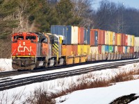 Southern Ontario didn't have much of a winter. There's a lot less snow than usual as 180 rumbles into Medora, where VIA 2 will run around it.....something I haven't seen very often.