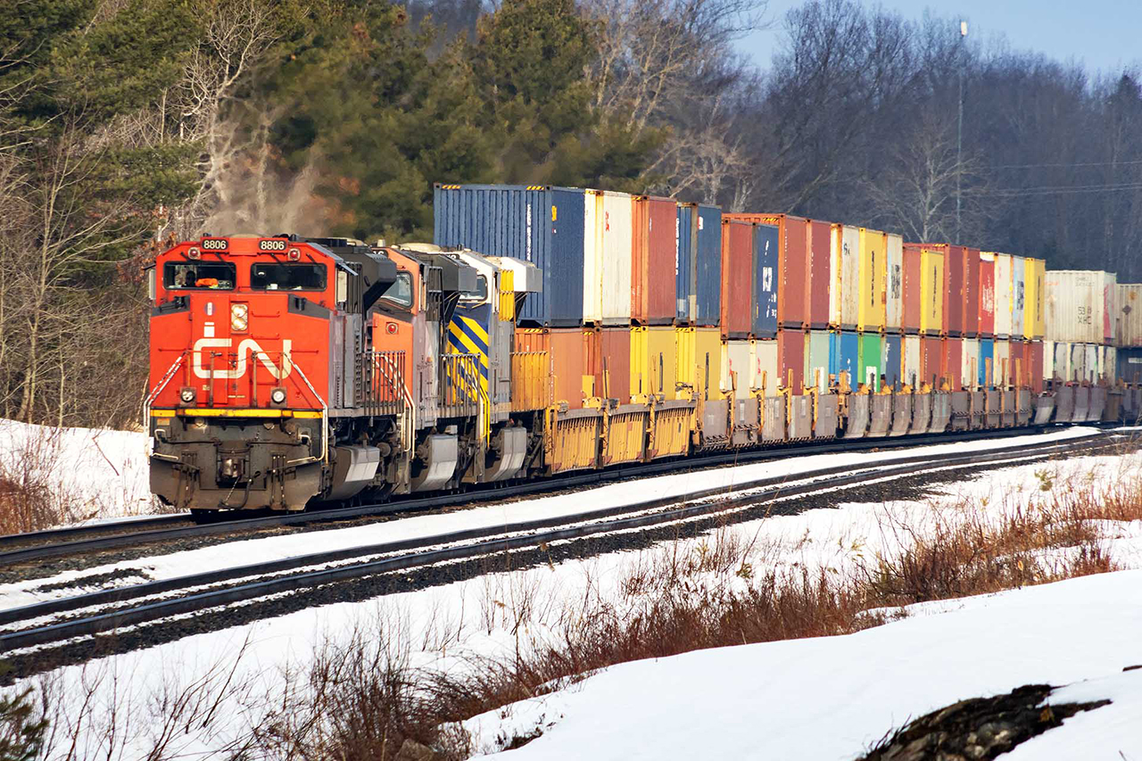 Southern Ontario didn't have much of a winter. There's a lot less snow than usual as 180 rumbles into Medora, where VIA 2 will run around it.....something I haven't seen very often.